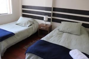 Postel nebo postele na pokoji v ubytování Cayma Apart's II