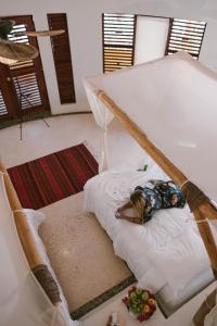Cama ou camas em um quarto em Hotel Okaan