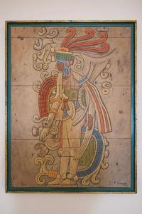 a painting of a man with a sword at Hotel Okaan in Chichén-Itzá