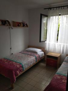 Postel nebo postele na pokoji v ubytování Apartment Ana M