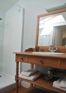 a bathroom with a sink and a mirror at Garros in Fronsac