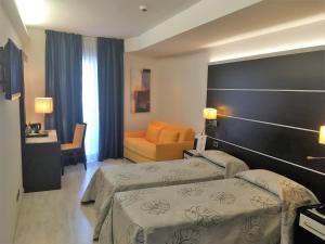 Postel nebo postele na pokoji v ubytování Hotel Villa Rosa
