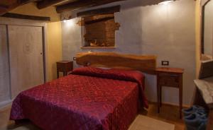 Кровать или кровати в номере Antico Restauro