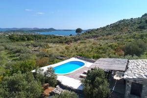 an aerial view of a house with a swimming pool at Holiday Home Petar in Drage