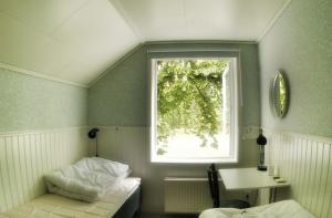 Postel nebo postele na pokoji v ubytování Lundsbrunn B&B