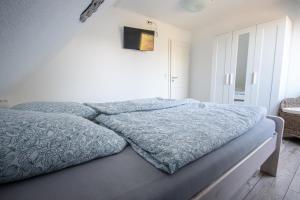 Postel nebo postele na pokoji v ubytování Ferienwohnung Dons