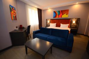 Postel nebo postele na pokoji v ubytování Batumi Palm Hotel