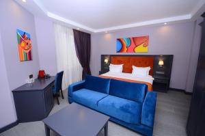 Postel nebo postele na pokoji v ubytování Batumi Palm Hotel