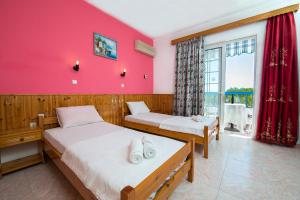 Katil atau katil-katil dalam bilik di Poseidon Apartment