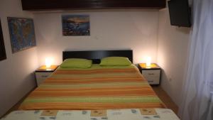 Posteľ alebo postele v izbe v ubytovaní Apartments Komel