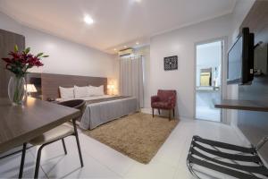 Postel nebo postele na pokoji v ubytování Hotel Porto Madeira