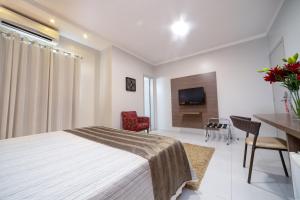 Postel nebo postele na pokoji v ubytování Hotel Porto Madeira