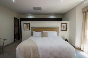 Cama o camas de una habitación en Condos & Penthouse El Caracol