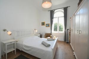Posteľ alebo postele v izbe v ubytovaní Central apartment with beautiful sea view