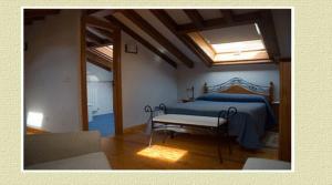 a bedroom with a bed and a table in it at Apartamentos Brisas del Deva in Potes