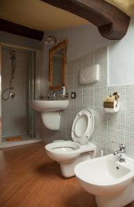 a bathroom with a toilet and a sink at Antico Restauro in Fonni