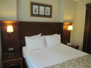 Cama ou camas em um quarto em Hotel Perula & SPA