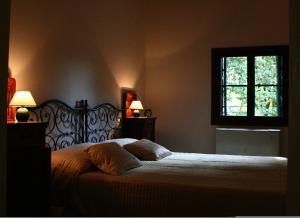 Katil atau katil-katil dalam bilik di Agriturismo Barchessa