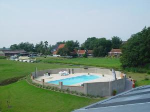 an overhead view of a swimming pool in a field at Piaam State in Piaam