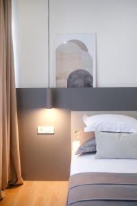 Postel nebo postele na pokoji v ubytování Apartments HUGO 2