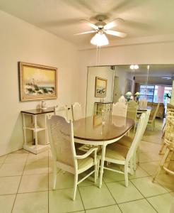 a dining room with a table and chairs at Siesta Key Beach 5830 #T34 in Siesta Key