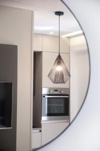 Kuchyň nebo kuchyňský kout v ubytování Apartments HUGO 2