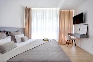 Postel nebo postele na pokoji v ubytování Apartments HUGO 2