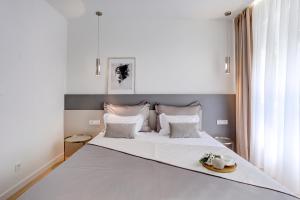 Postel nebo postele na pokoji v ubytování Apartments HUGO 2