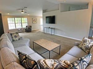 a living room with two couches and a table at Shell Beach Home 209 in Sarasota