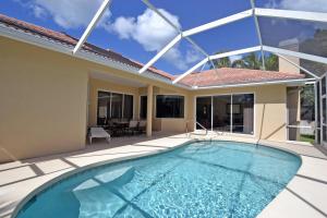 a swimming pool in the backyard of a house at Siesta Key Beach - Cape Aqua 5545 in Siesta Key