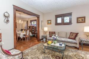 a living room with a couch and a table at Ambiance By The Falls B&B in Niagara Falls
