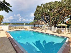 a swimming pool with a view of the water at Sea Club II 5955 #8E in Siesta Key