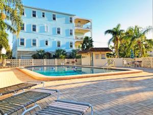 a swimming pool in front of a building at Siesta Key Beach 5950 #317 in Sarasota