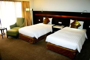 Postel nebo postele na pokoji v ubytování Century Park Hotel