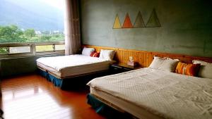 Postel nebo postele na pokoji v ubytování Ying Tian Ye Homestay