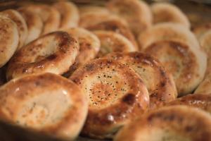 a pile of bagels sitting on a baking sheet at Friday in Tashkent