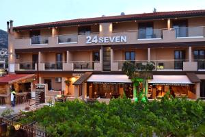a hotel with a sign that reads seven at 24 Seven Boutique Hotel in Malia