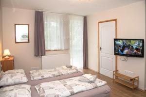 Posteľ alebo postele v izbe v ubytovaní Deluxe Apartments