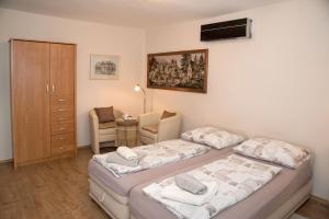 Posteľ alebo postele v izbe v ubytovaní Deluxe Apartments