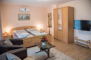 Posteľ alebo postele v izbe v ubytovaní Deluxe Apartments