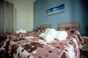 Postel nebo postele na pokoji v ubytování B&B L'Aurora CAPUA