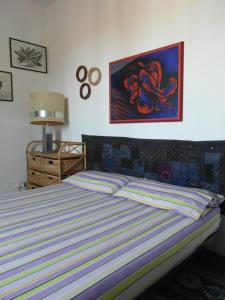 A bed or beds in a room at Abitazione Pigneto B&B