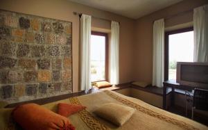Postel nebo postele na pokoji v ubytování Tufenkian Avan Marak Tsapatagh Hotel