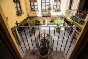 an overhead view of a balcony with potted plants at Alh Patio Apartamentos in Granada