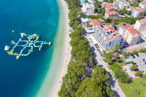 an aerial view of a beach and the ocean at Apartments Villa Bondi in Makarska