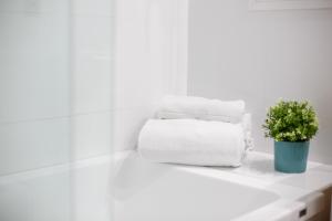 A bed or beds in a room at Center City Flats