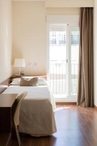 A bed or beds in a room at Center City Flats