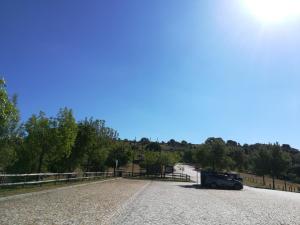 a car parked on the side of a road at Casa do Azibo in Santa Combinha