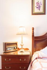 Ein Bett oder Betten in einem Zimmer der Unterkunft El Sitio La Rosa
