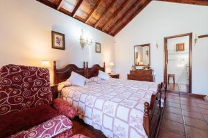 Ein Bett oder Betten in einem Zimmer der Unterkunft El Sitio La Rosa